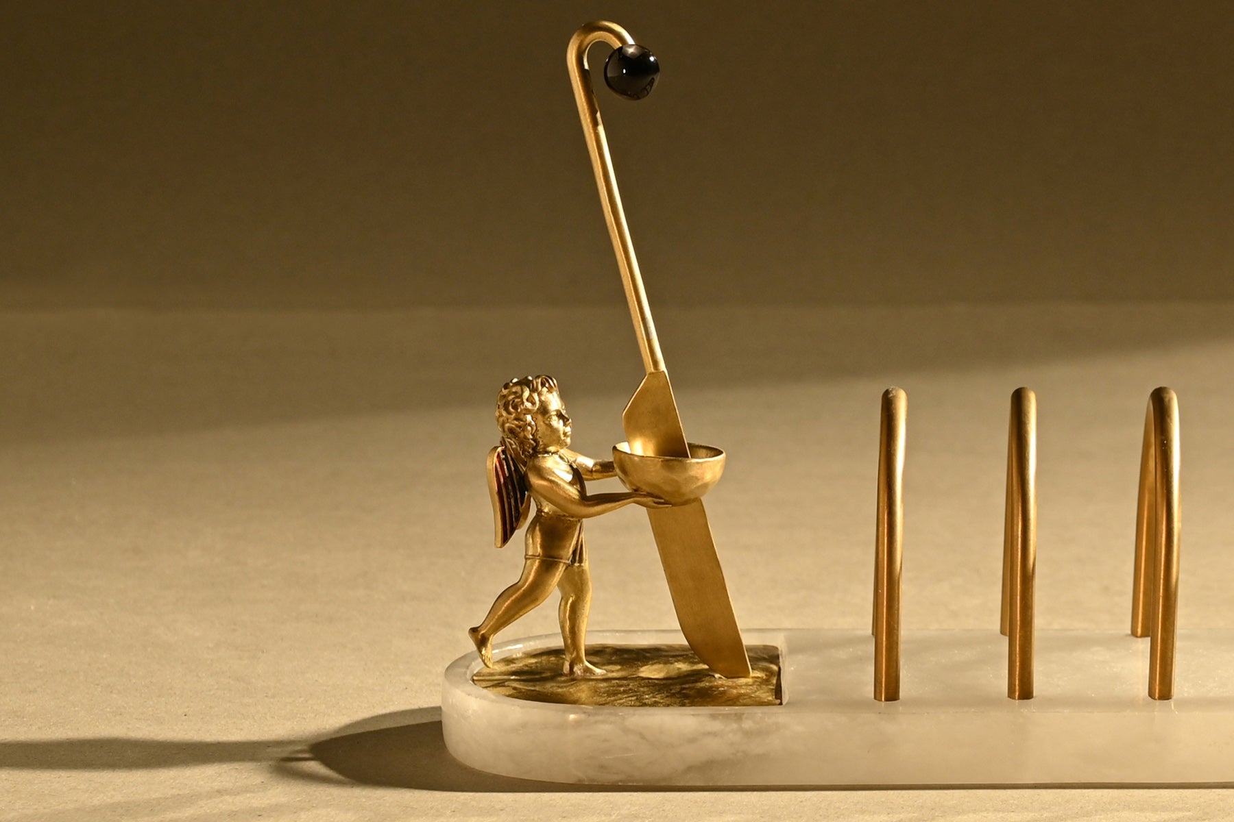Elysium Breakfast Board detail — cherub and brass hardware by Ira Udaipur